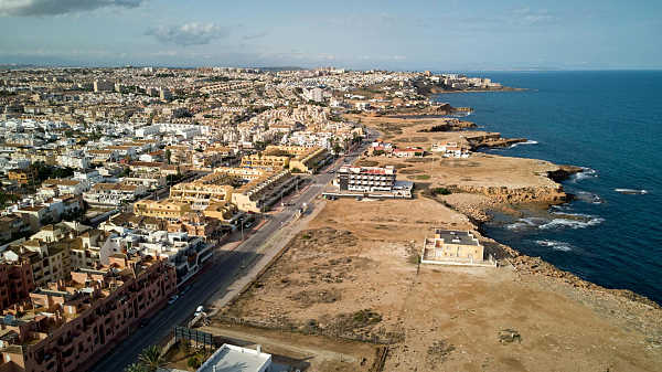 Aerial view of Torrevieja coastline and urban blocks