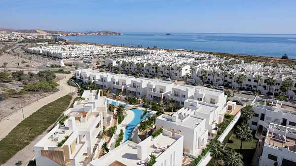Aerial architectural render of the development beside the coast
