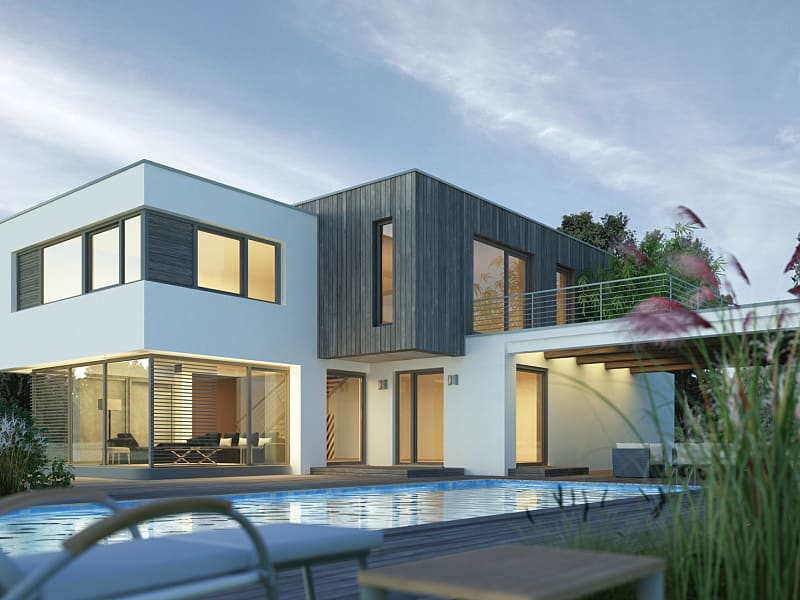 Villa moderna con piscina al atardecer