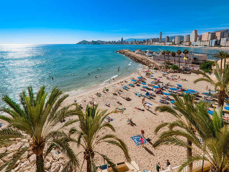 Tourists relaxing by the Mediterranean Sea