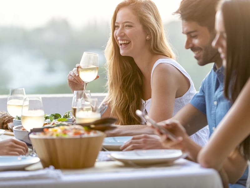 Friends enjoying dinner together in Spain