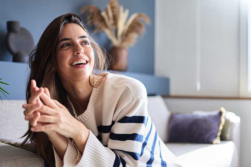 Woman relaxing on the sofa in her Spanish home