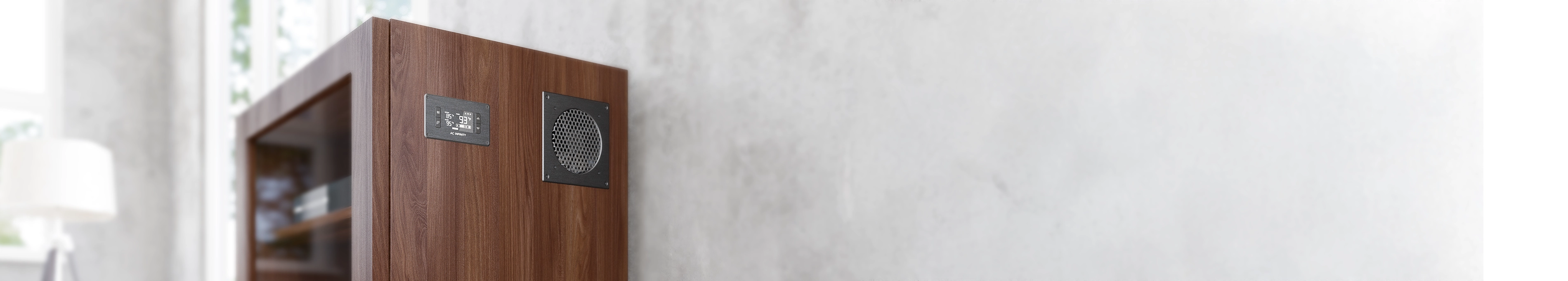 Airplate series cooling system with a digital controller and intake grille mounted on a dark wood grain AV cabinet.