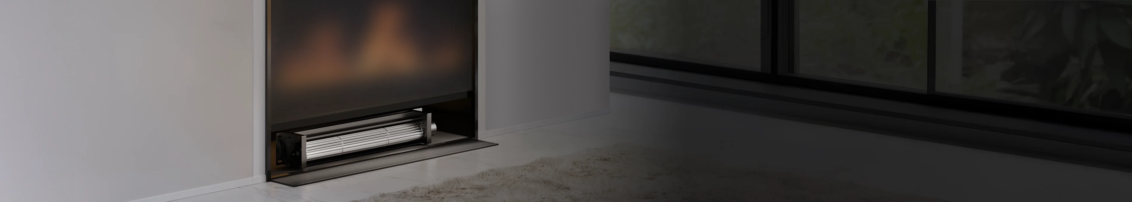 Modern indoor fireplace with a built-in Airblaze series blower fan installed underneath.