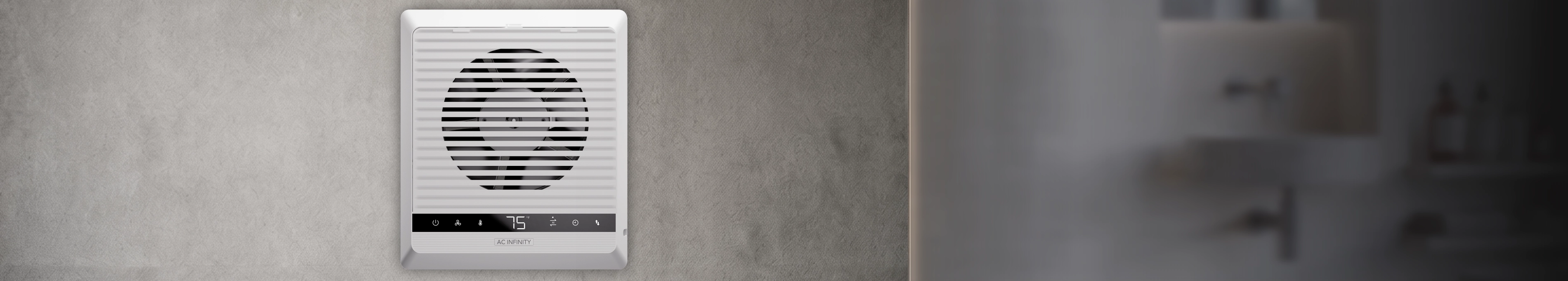 Room to Room Fan Reversible Exhaust System with built-in digital controller display mounted on a wood paneled wall.