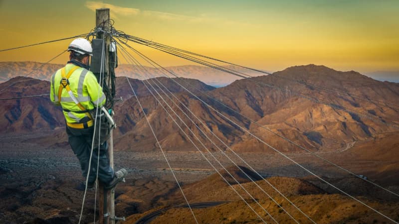 Man working on a telephone pole