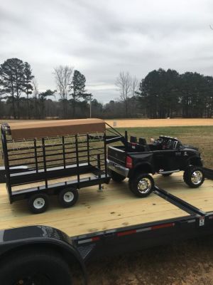 Auction Page | Kid Trax Dodge toy truck with a six foot stock trailer