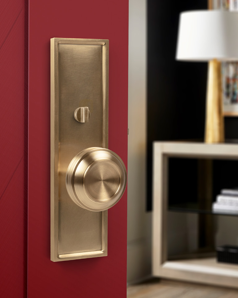 Thom FIlicia For Accurate Carrera Knob beauty shot, US4 Satin Brass on Red Door
