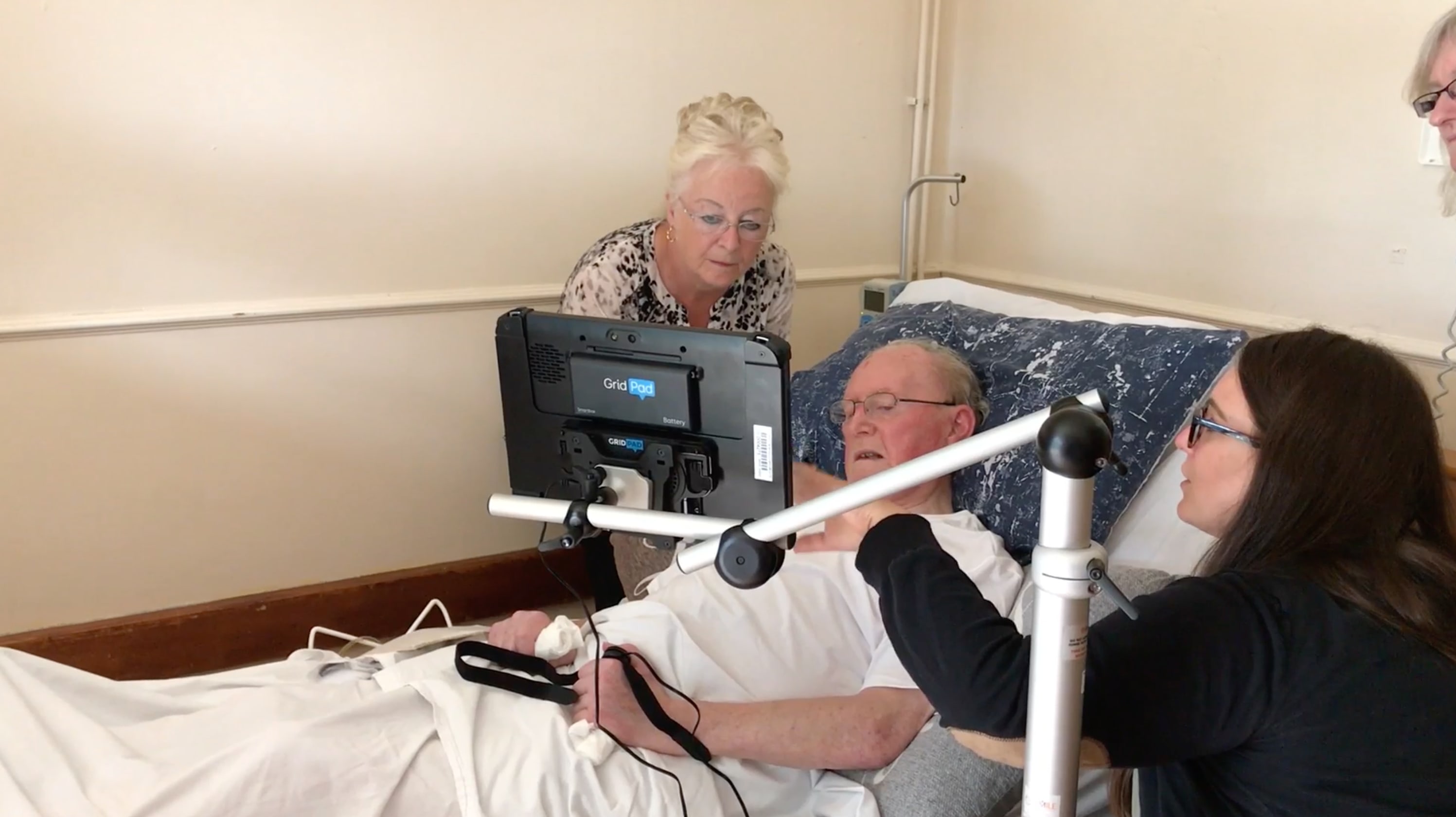 Person with an AAC device mounted to their wheelchair