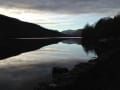 Low November light reflecting the hills at the western end of Loch Arkaig.