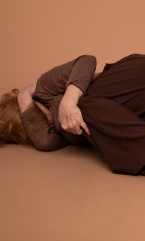 Someone curled up on the floor