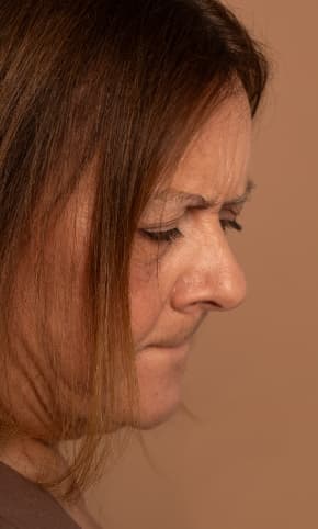 A woman looking downwards