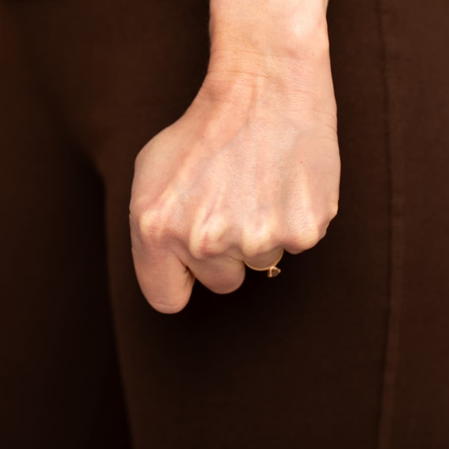 A hand curled into a tight fist