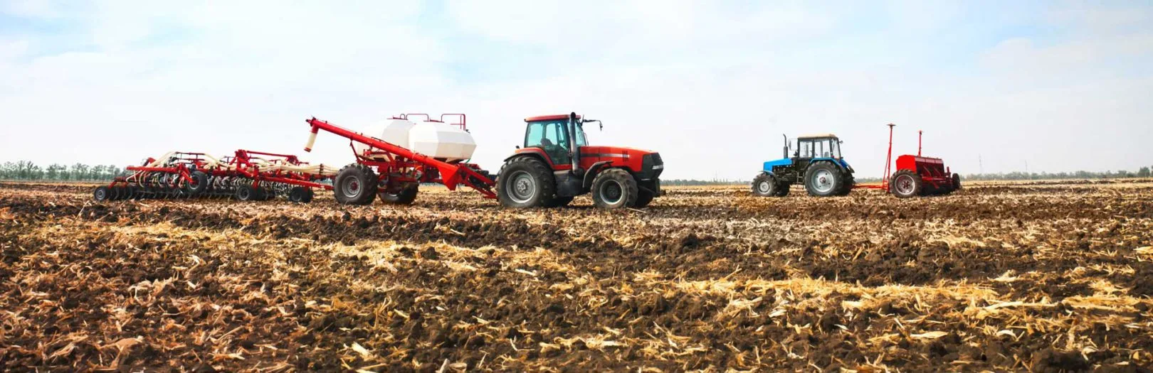 Tractors farmers field.
