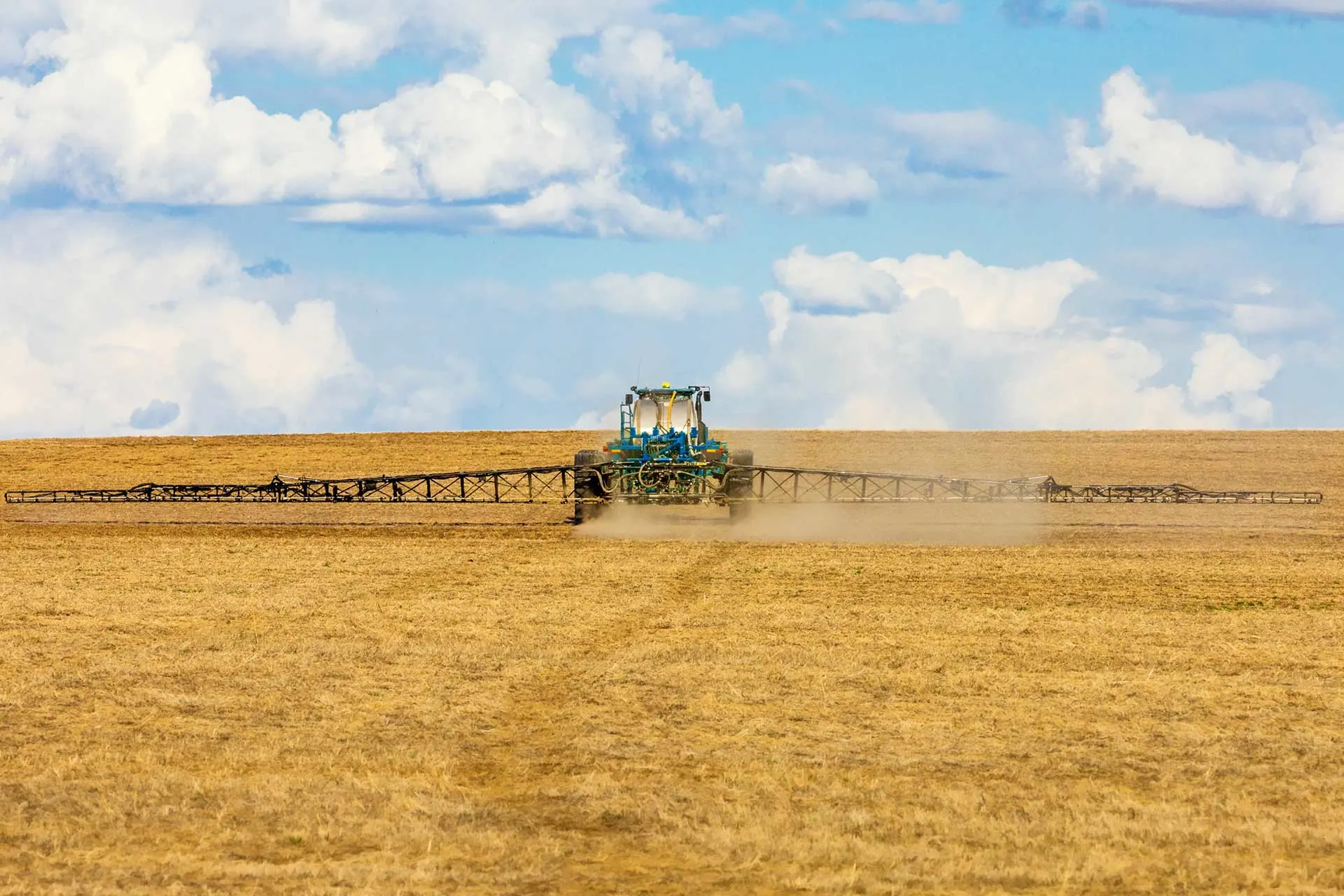 Tractor applies nitrogen fertilizer in the fall.