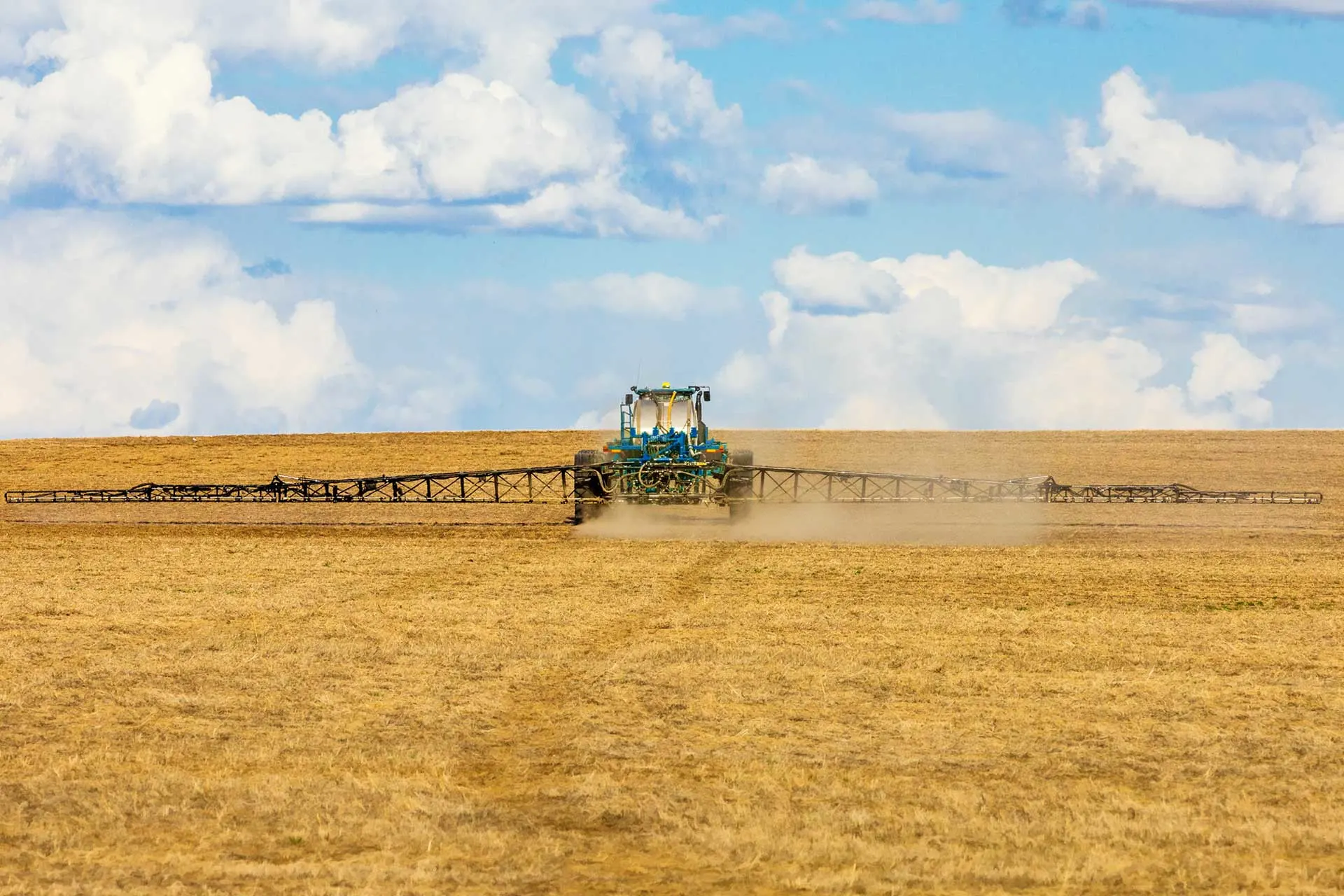 Tractor applies nitrogen fertilizer in the fall.
