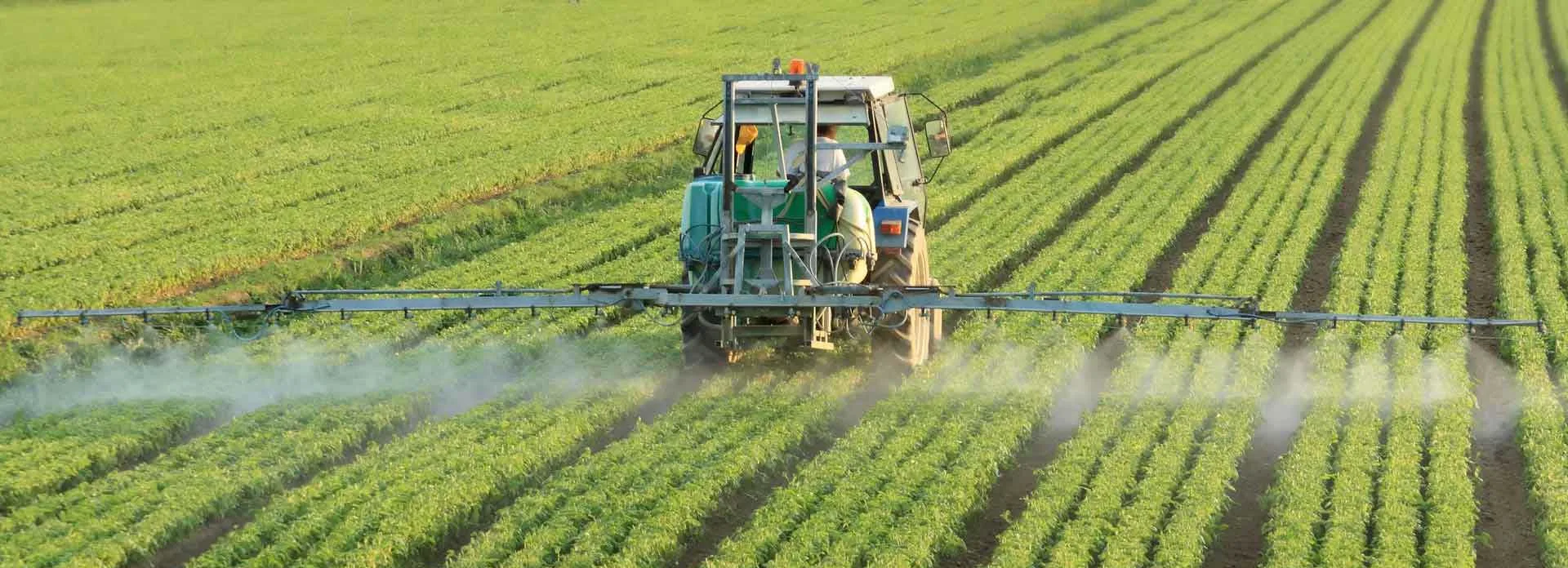 Tractor spraying herbicide.
