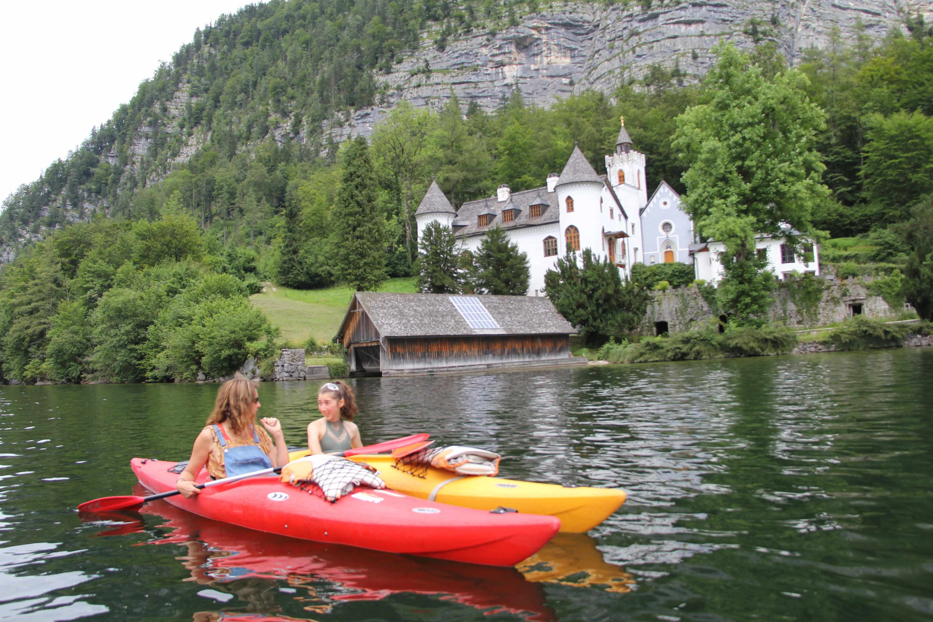 Family kayaking by castle on Austria Family Vacation