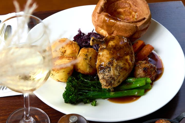 Traditional Sunday Roast with a Glass of Wine for Two