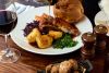 Traditional Sunday Roast with a Glass of Wine for Two
