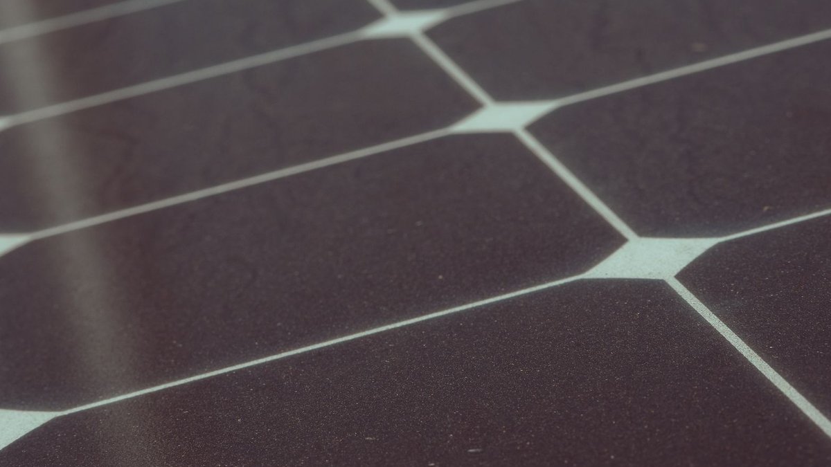 SE Systems Expands in Dublin Hill, Creating 150 Jobs Detailed view of solar panel cells for alternative energy generation and innovation in technology.