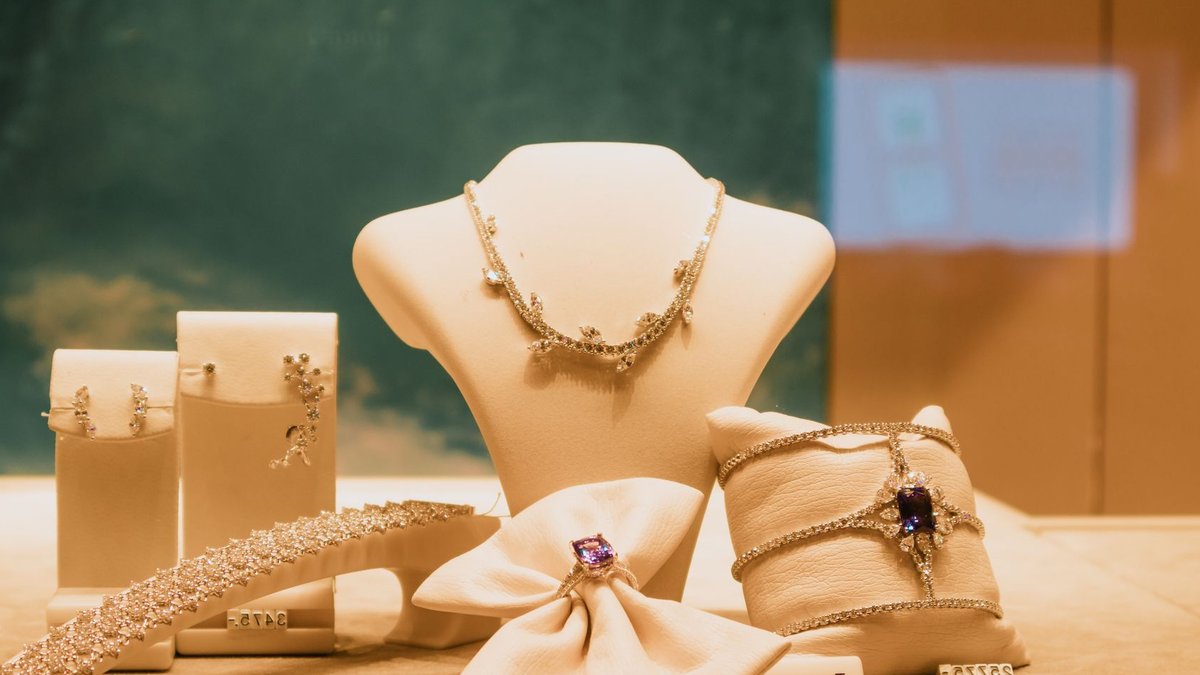 Titan buys majority stake in Dubai luxury jeweler Damas Luxury jewelry display with tansanit and diamond pieces in a store.