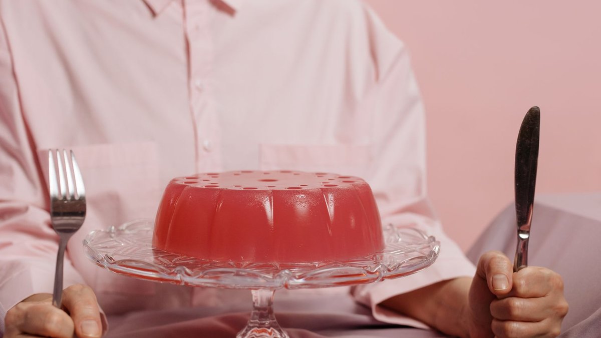 Elegant table setting with red gelatin dessert, evoking a sweet and inviting atmosphere.