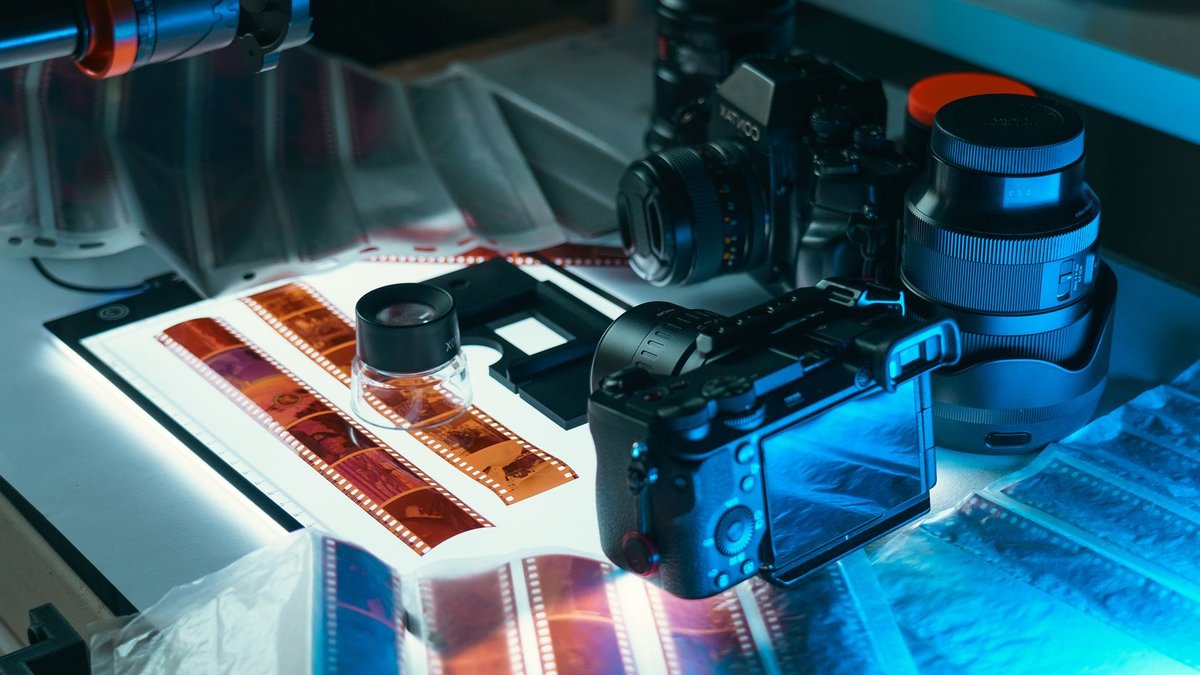 A comprehensive setup for digitizing analog film negatives to digital format in a photography studio.