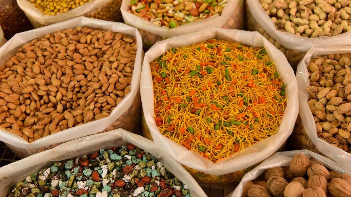 Whole Foods wins discrimination case Variety of nuts and spices displayed in bags, showcasing colorful and diverse food options.
