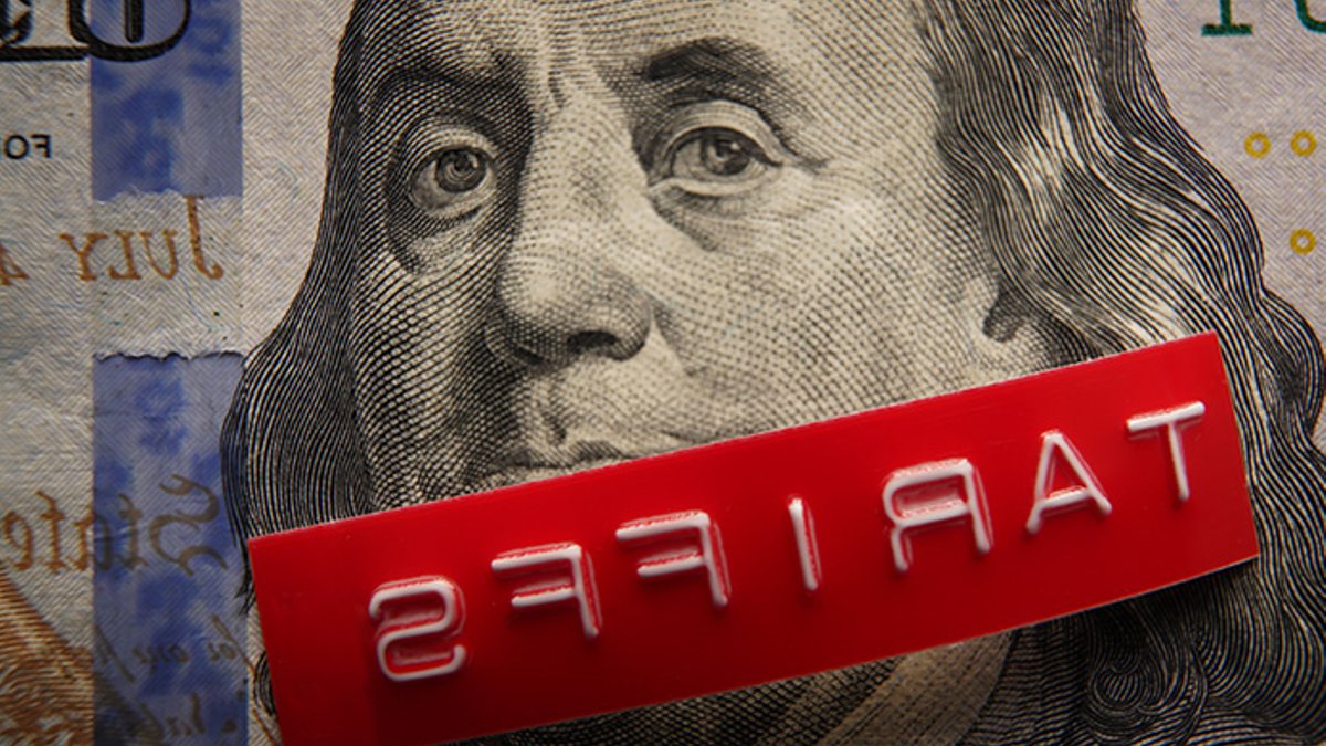 Red Tariffs label on a hundred dollar bill.