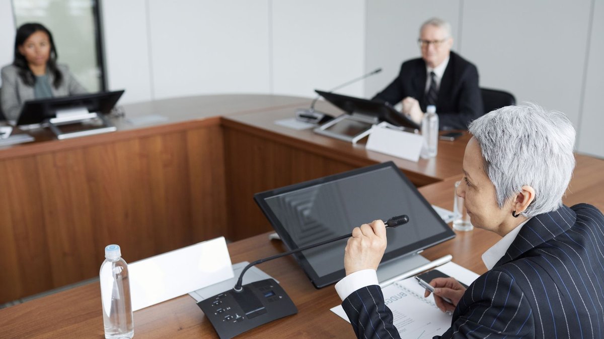 CHROs face challenges leading AI-driven workforce changes Senior executives discussing strategies in a modern boardroom setting.