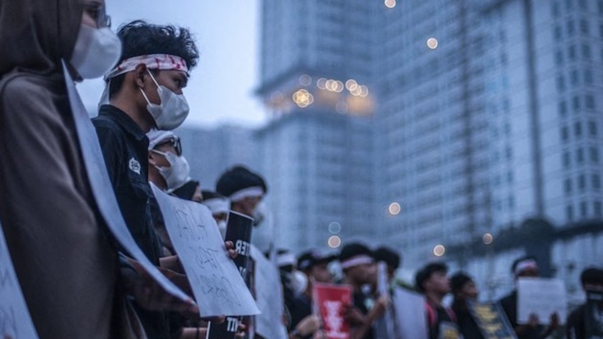 Protesters from Aksi Kamisan Medan hold a demonstration over land and forest fires that have caused air pollution in Medan, i