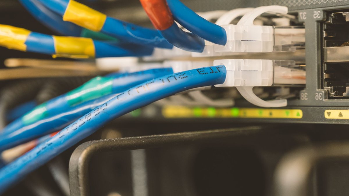 MicroVision, Blue-Band Team Up on LiDAR Traffic Solutions Network switch and blue ethernet cable with white tips connected to system for maintenance.