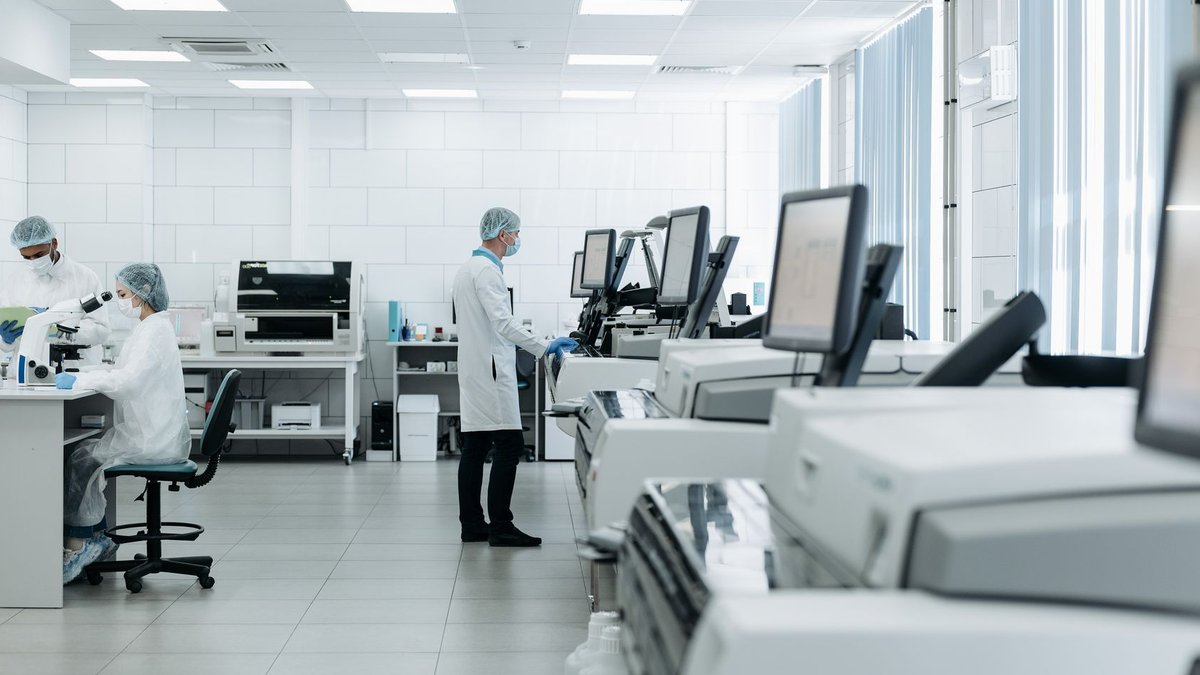 Surgery reverses immune damage from obesity Scientists conducting research in a state-of-the-art laboratory with advanced equipment.