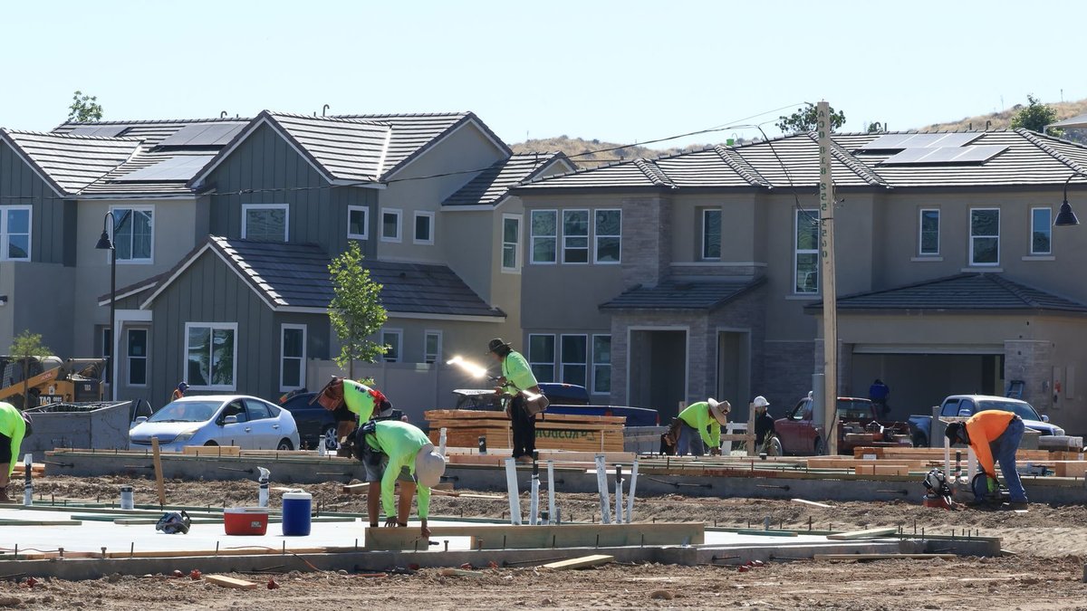 Dallas Housing Market Stays Resilient Despite Affordability Challenges Construction workers laying foundations in a modern housing development.