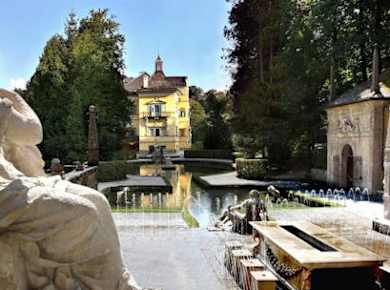 Bootsfahrt zum Schloss Hellbrunn mit Wasserspielen und Londoner Doppeldeckerbus