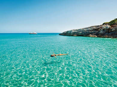 South-west Menorca cruise with paella lunch