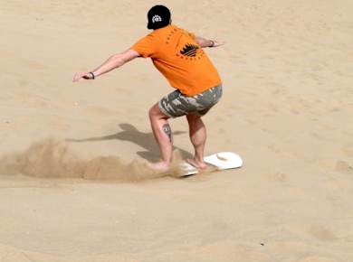 Sandboarding - Sand surfing