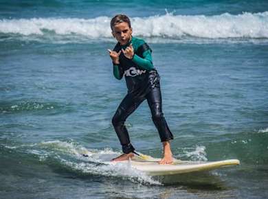 Family surfing session in the south of Fuerteventura