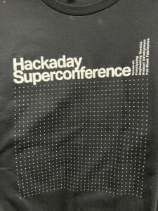 The text Hackaday Superconference on a black shirt