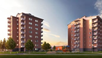 The NCC Folkboende buildings, in a characteristic Swedish style with "built in" balconies, leaning roof and brown facade.