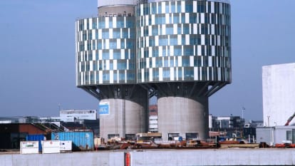 Picture of the Portland Tower, converted from an old silo (with the buildings foot essentially the same), but the upper part turned into cylindrical glass walls.