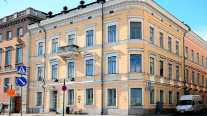 The corner of former Lampan Talo hotel, with a yellow facade in classic late 1800/early 1900-style.