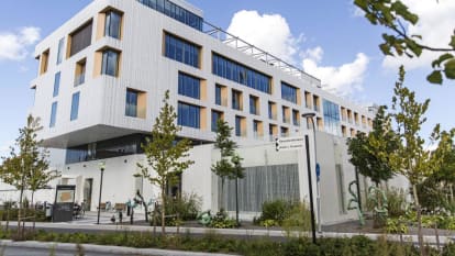 The Skandion Clinic in Uppsala, with fat, concrete, reliefed walls and windows of varying size.