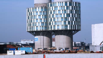 Picture of the Portland Tower, converted from an old silo (with the buildings foot essentially the same), but the upper part turned into cylindrical glass walls.