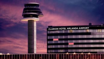 Arlanda during the evening darkness. The control tower is visibile to the left, Clarion Hotel to the right.