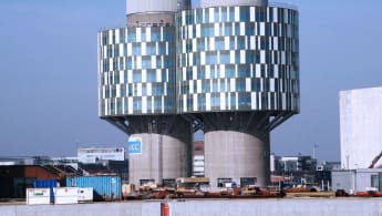 Picture of the Portland Tower, converted from an old silo (with the buildings foot essentially the same), but the upper part turned into cylindrical glass walls.