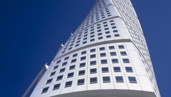 Ground view of the towering Turning Torso, with its distinctive shape.