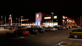 The lit up Home Center Lielahti during the night.