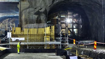 Picture of Norrströmstunneln, part of Citybanan, under construction. Marks for explosives are visible on the roof. Straight forward are the entrance from the metro Blue line to the commuter rail station.